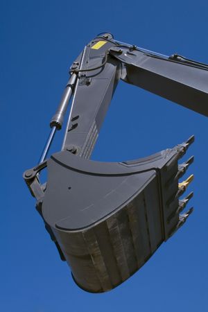 Shovel bucket against blue skyの写真素材