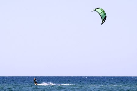 Kiteboarder enjoy surfing in the seaの写真素材