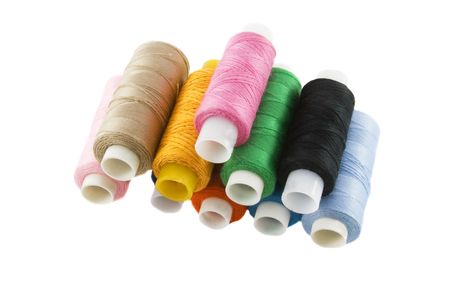 Many colorful threads over the white backgroundの写真素材