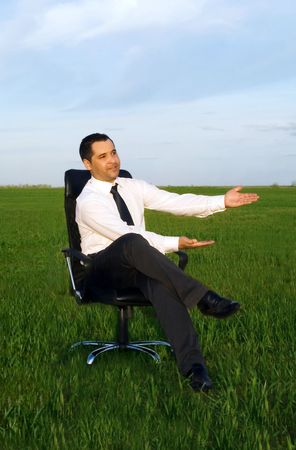 businessman take energy from nature in the meadowの写真素材