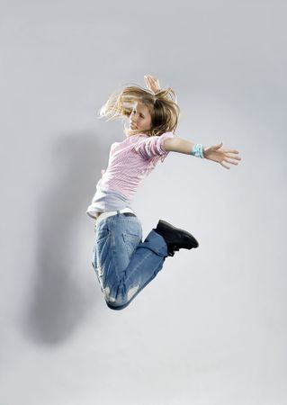 Teenage girl dancing breakdance in actionの写真素材