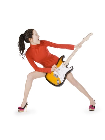 Sexy young female posing with guitar over whiteの写真素材