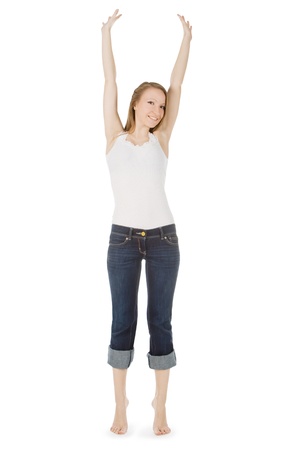 bright picture of happy and carefree teenage girl in jeans over whiteの写真素材