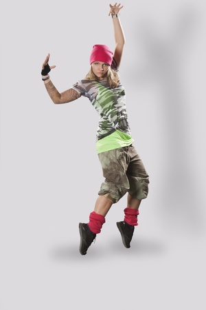 Teenage girl dancing breakdance in actionの写真素材