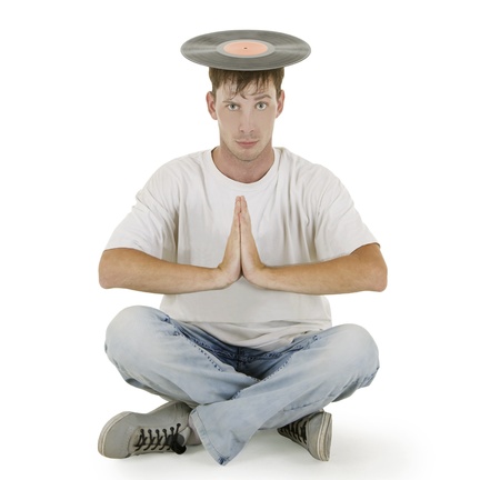 DJ sitting on the floor with vinyl on his headの写真素材