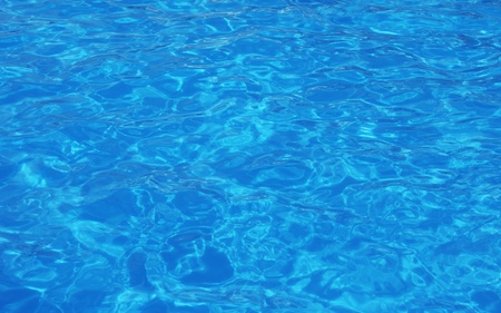 beautiful clear pool water reflecting in the sunの写真素材