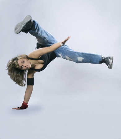 Teenage girl dancing breakdance in actionの写真素材