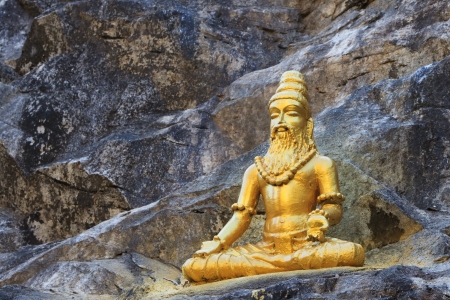 Buddhist golden statue man meditating の写真素材