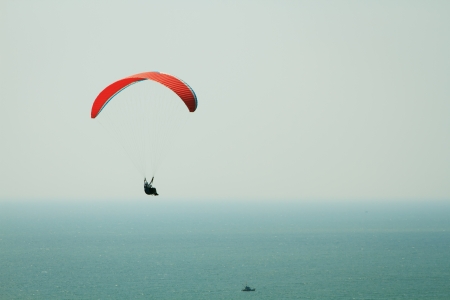 Paraplane flight. Paraplane flight over the sea