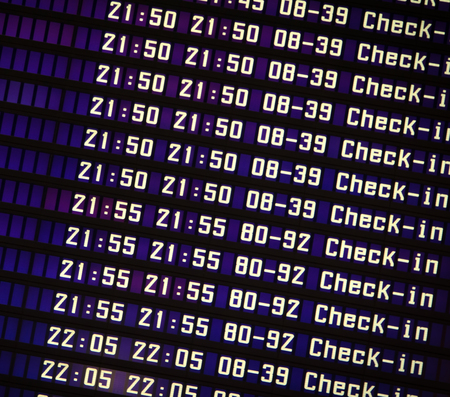 Flights information board in airport terminalの写真素材