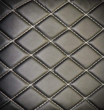 Genuine leather upholstery background for a luxury decoration in black tonesの写真素材