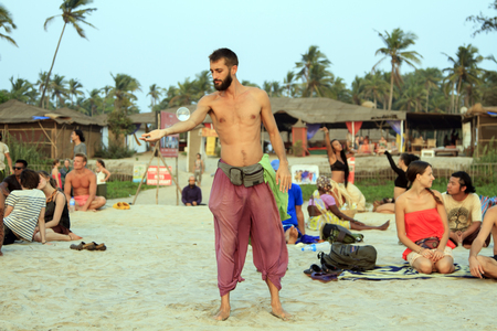 Goa, India â February 15, 2016: Unidentified man juggling with glass ball on the beachのeditorial素材