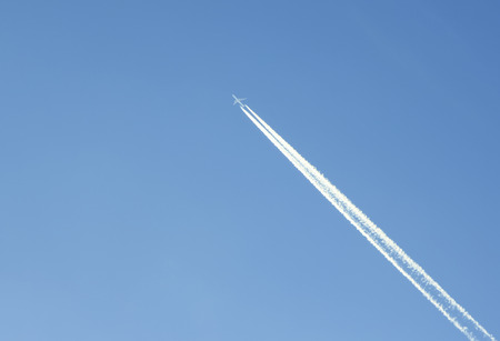 trace of an airplane against blue sky