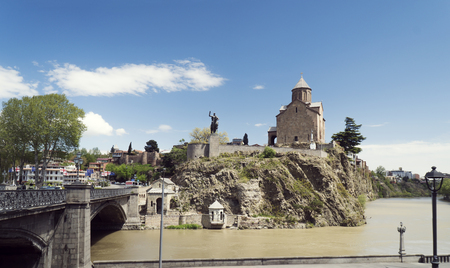 Tbilisi, Georgia - April 25, 2017: View to the statue of Gorgasali king and Metekhi Cathedral