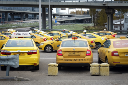 Moscow, Russian Federation - October 22, 2017: Cars from service Yandex Taxi wating for the order at...