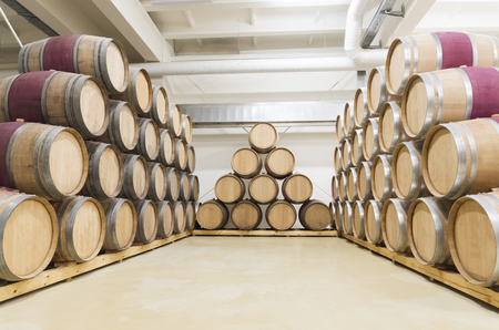 Sennoy, Russian Federation â€“ February 14, 2018: Wine barrels stacked in the old cellar of the...