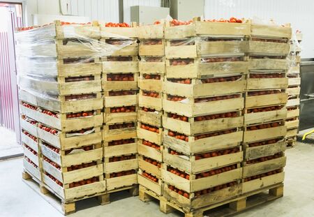 Many boxes with red in the recycling workshop