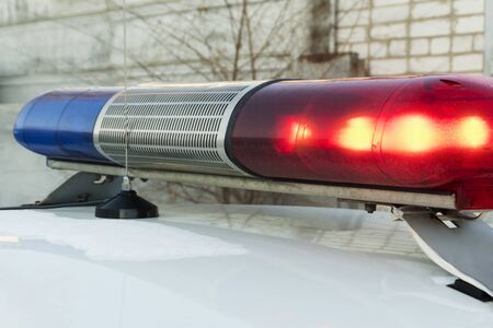 Police blue and red lamp flashing spinningの写真素材