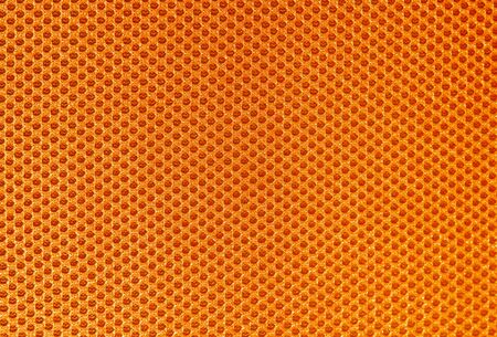 Closeup of orange textile for backgroundの写真素材