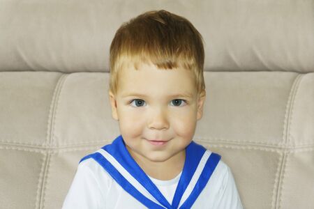 Handsome little boy in sailor suitの写真素材