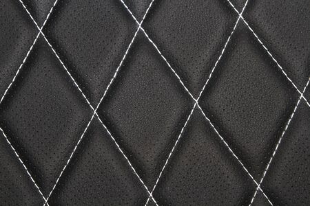 Genuine leather upholstery background for a luxury decoration in black tonesの写真素材