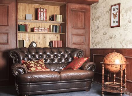Moscow, Russian Federation - February 02, 2015: Retro brown leather couch, lounge sitting roomの写真素材
