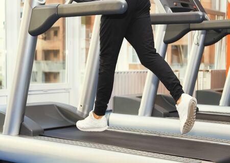 People at the gym exercising. Run on a treadmillの写真素材