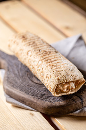 shawarma on a wooden background. Shallow depth of field.