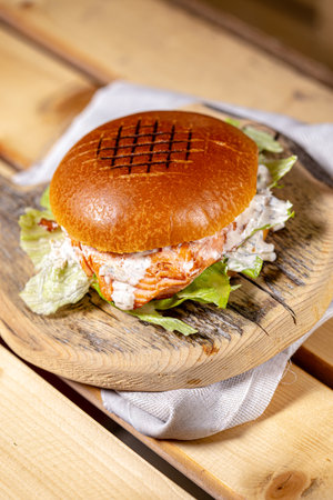 sandwich with salmon and salad on a wooden background. tinting. selective focusの写真素材