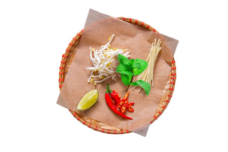 Thai style noodle with herbs and spices on white background.