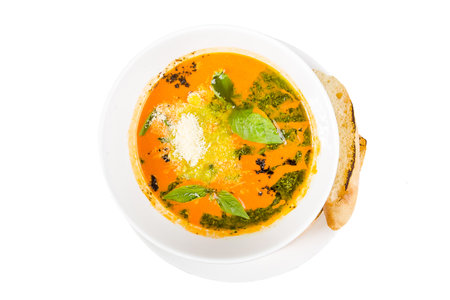 Pumpkin soup in a bowl isolated on a white background.の写真素材