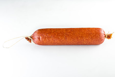 Smoked sausage on a white background, isolate, copy space.の写真素材