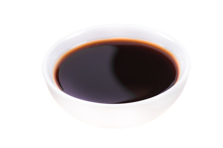 Soy sauce in a bowl isolated on white backgroundの写真素材