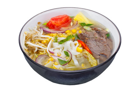 Thai noodle soup in black bowl isolated on white background.