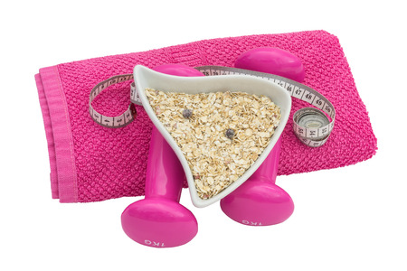 dumbbell with a plate of oatmeal on a towelの写真素材