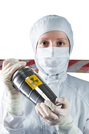 a scientist holding a container with radiation in the affected areaの写真素材
