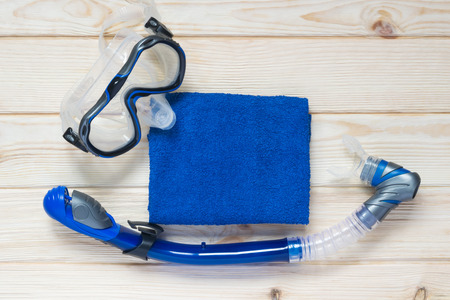 Things sinii for swimming with a towel on the tableの写真素材