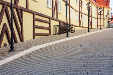 empty old street with parking for bicyclesの写真素材