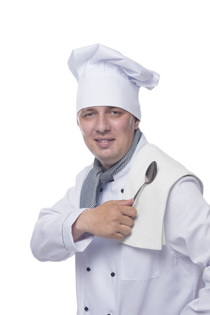 chef in white with a spoon in his handの写真素材