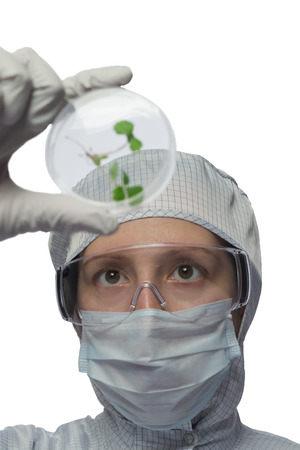 Woman in a suit holding a medical vial circle with the germ at the insideの写真素材