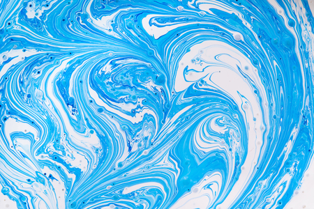 background white paint mixed with blueの写真素材