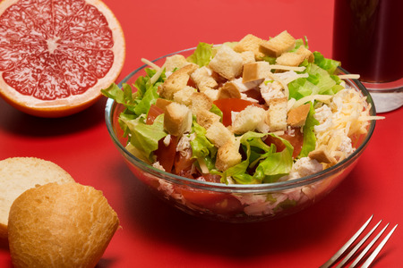 Caesar salad and fruit juice on the tableの写真素材