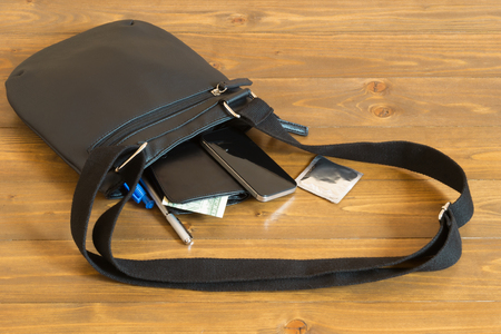 Men's things out of the bag on the tableの写真素材