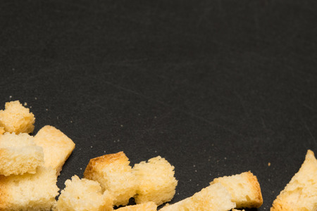 black board at the bottom of a dry white bread, and there is a place for an inscriptionの写真素材