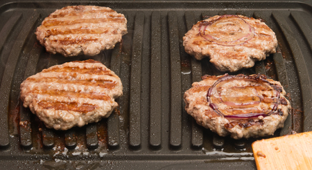 four pieces of fried meat grilledの写真素材