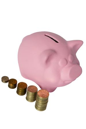 pink pig on a white background and a number of metal moneyの写真素材