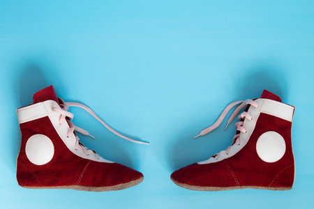 Leather shoes are to fight on a blue backgroundの写真素材
