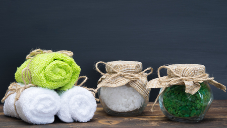 Two jars with salt and three towels on the table and there is a place for an inscriptionの写真素材
