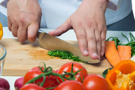 hand cook crushed herbs to dishesの写真素材