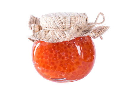 Bank of red caviar on a white backgroundの写真素材